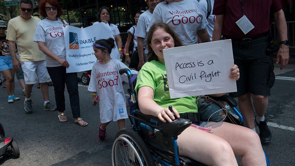 People participate in the first annual Disability Pride Parade on July 12, 2015, in New York City. The parade calls attention to the rights of people with disabilities and coincides with the 25th anniversary of the Americans with Disabilities Act. (Stephanie Keith/Getty Images)
