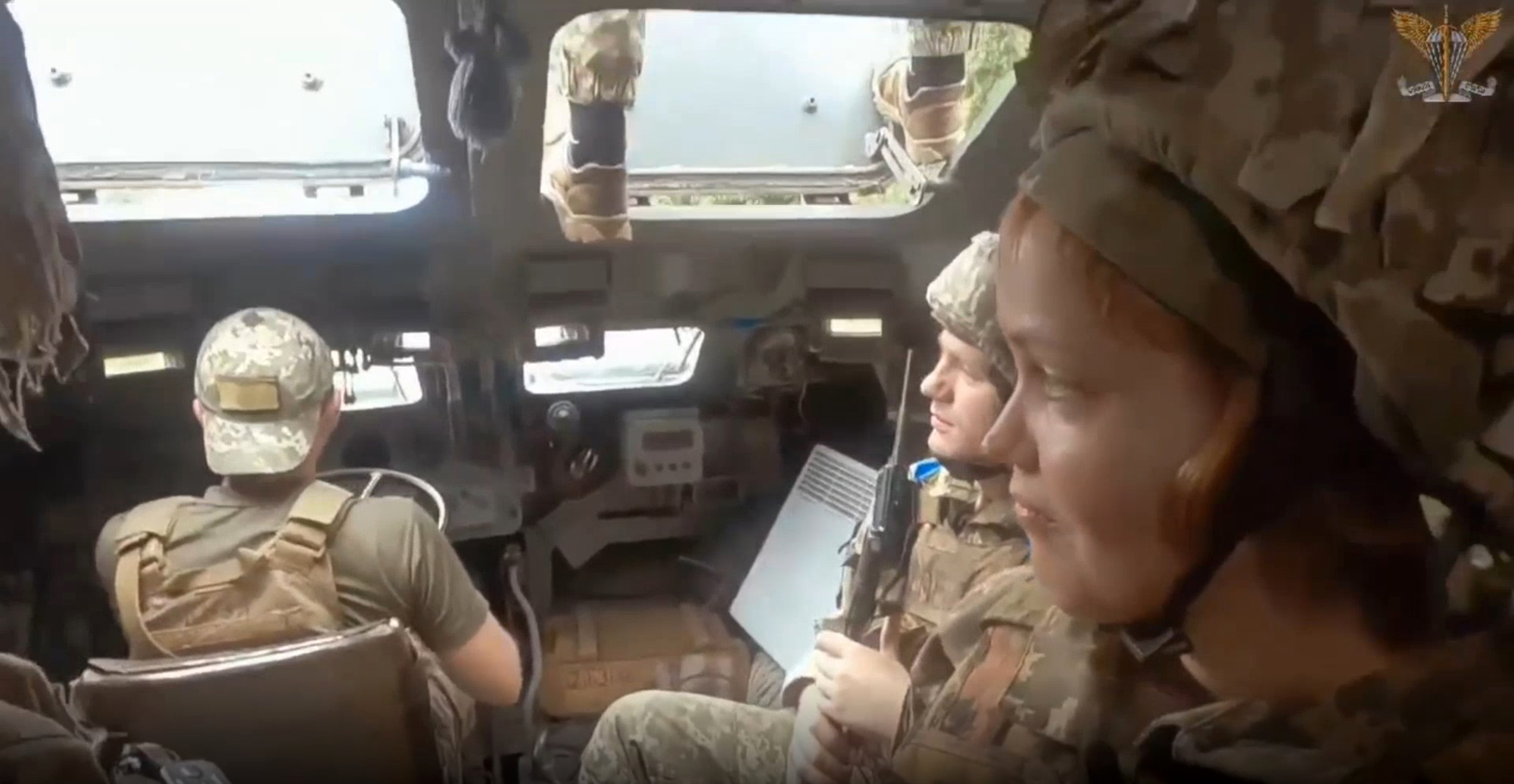 Signalmen paratroopers of the 79th separate amphibious assault brigade, including one female soldier, sit inside of a military vehicle, Ukraine in an undated photo. The 79th Air Assault Brigade, based in Mykolaiv, is a formation of the Ukrainian Air Assault Forces. (@79AMBUA/Zenger)