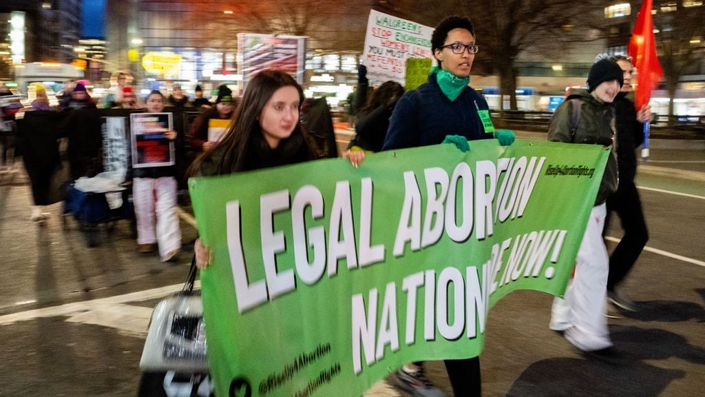 A small group of people march for abortion rights near a Duane Reade in Union Square on March 08, 2023 in New York City. Duane Reade, whose parent company is Walgreens, announced last Thursday that they would no longer distribute the abortion pill, Mifepristone, in 21 states where Republican attorneys general have threatened legal action. ALEXI ROSENFIELD/BENZINGA