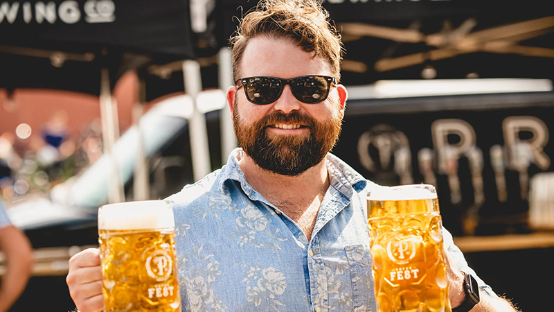  A lively Oktoberfest celebration at Pryes Brewing Company with people enjoying beer and live music.