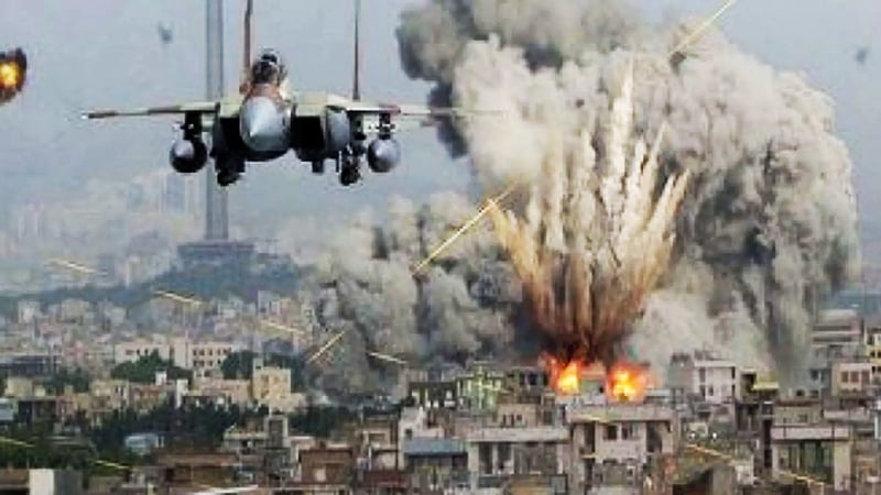 A fighter jet flying over a city engulfed in explosions and smoke, symbolizing the intensity of modern warfare and U.S. military involvement.