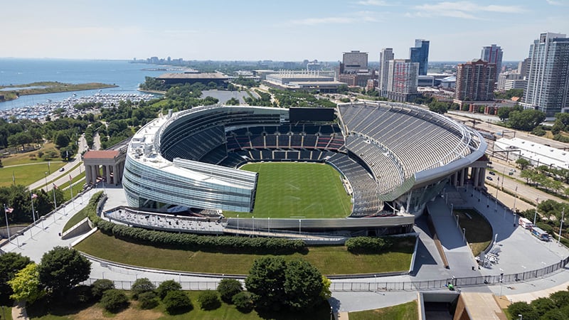 Aerial view of Soldier Field in Chicago, showcasing its modern design, lakefront location, and surrounding urban skyline.