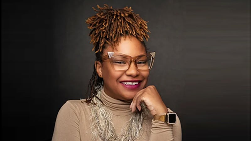 Devon Moody, founder of The 89th Collective, smiling confidently in a professional portrait.