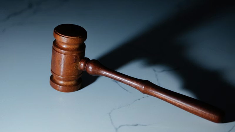 A courtroom scene symbolizing justice, with a gavel and legal documents, representing the sentencing of Theoplus Richmond for fentanyl-related crimes.