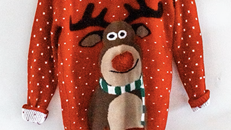 A festive red Christmas sweater with a reindeer design, perfect for holiday fun in St. Louis.