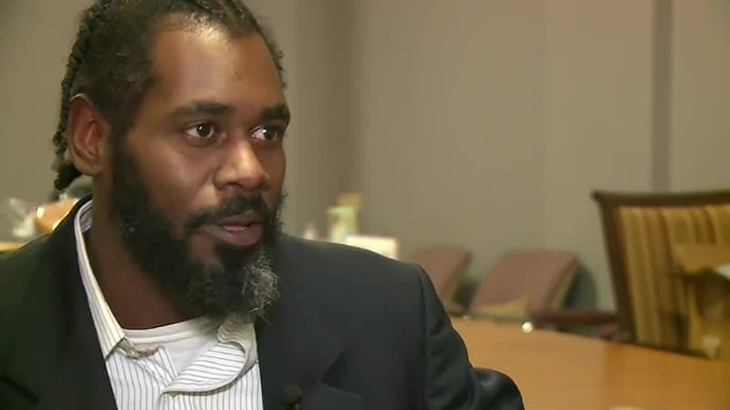 Brandon Bosley, former St. Louis alderman, during a public appearance, wearing a suit and speaking passionately.