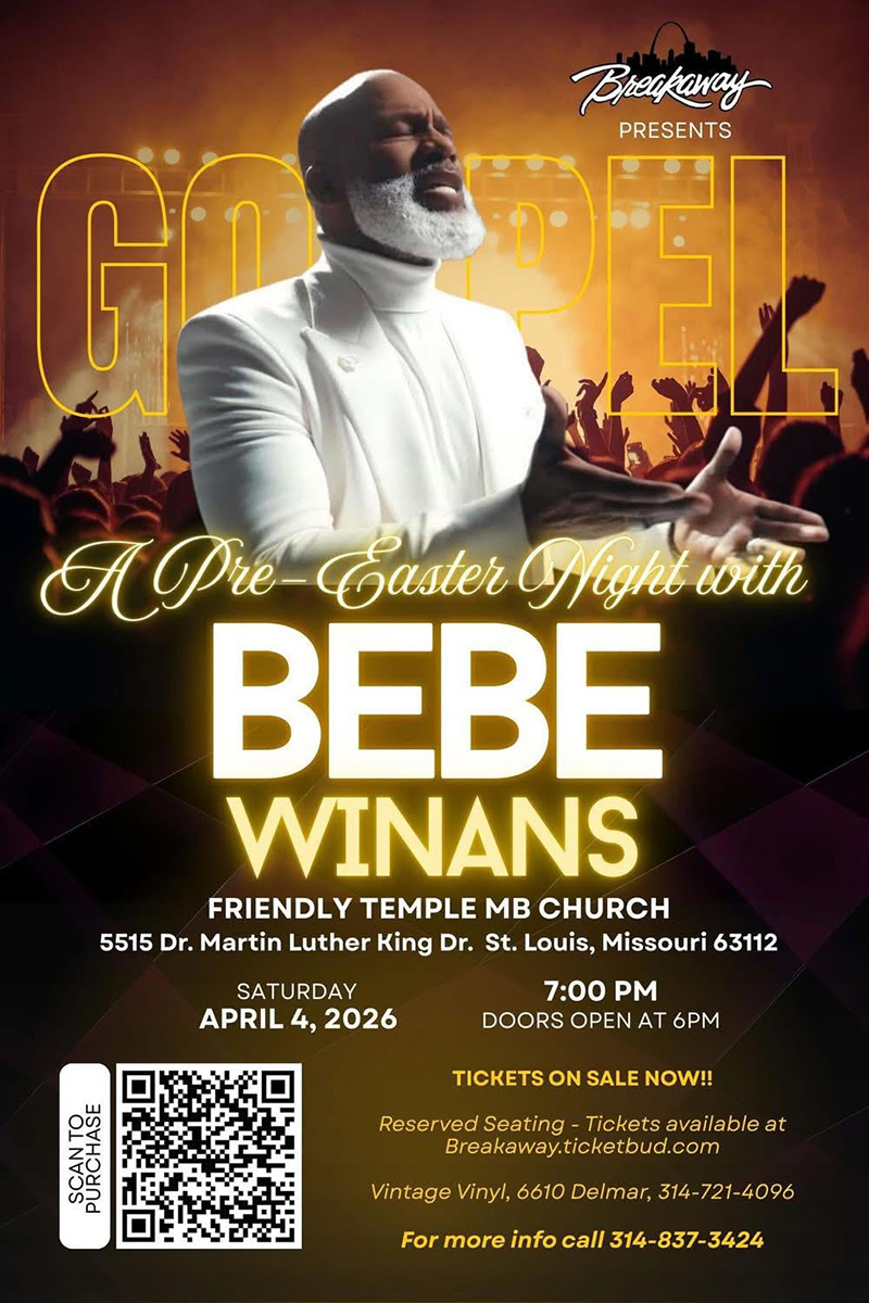 BeBe Winans performing in a white suit with an audience in the background.