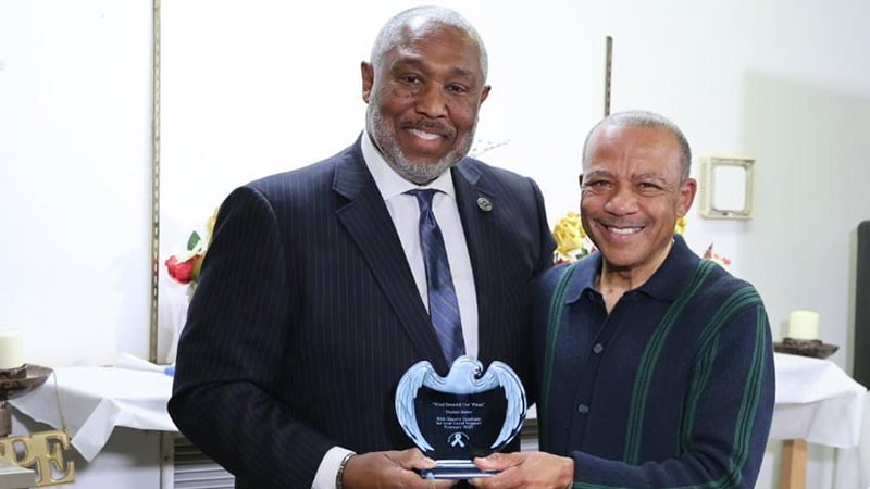 St. Louis leader Tom Bailey receiving the Wind Beneath Our Wings Award for prostate cancer advocacy.