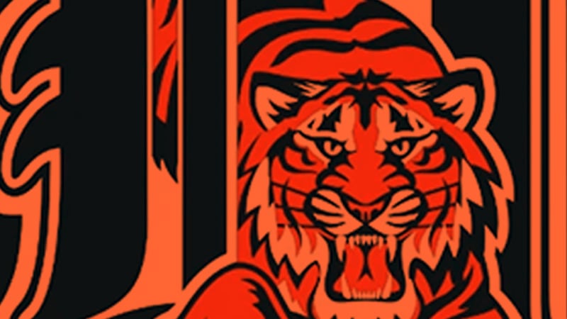 A stylized tiger's head in orange and black, snarling with sharp teeth, integrated into a bold graphic design resembling a letter "T" or "I" on a black background.