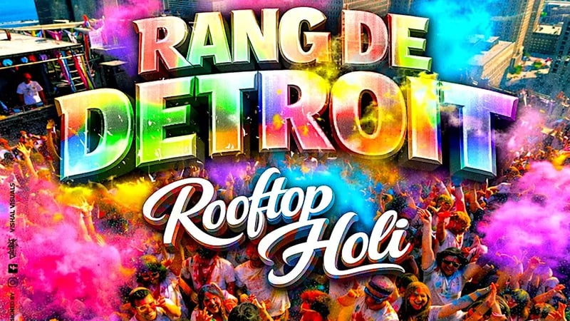 People celebrating Holi at Rang De Detroit with vibrant colors and music.