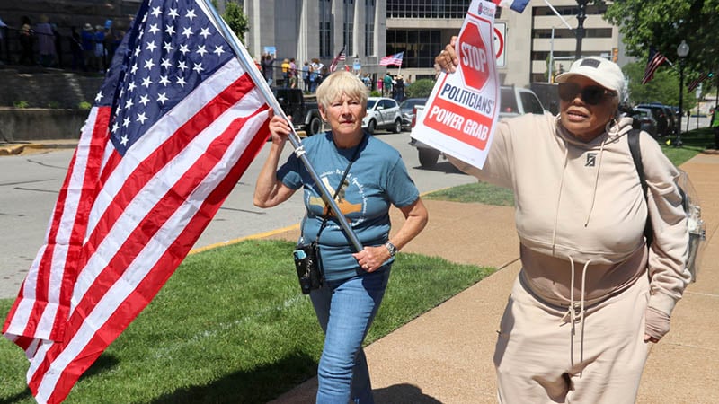 Protesters holding signs demanding fair maps outside the Missouri Supreme Court.