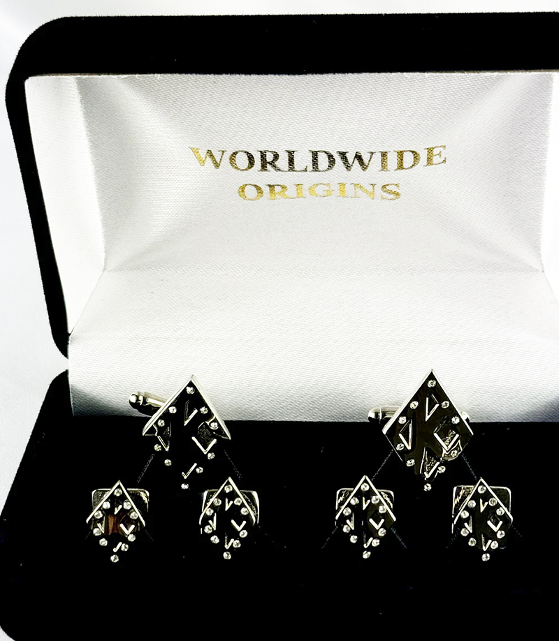 A six-piece formal jewelry set featuring diamond-shaped cufflinks and tuxedo studs with silver and black accents in a velvet-lined box.