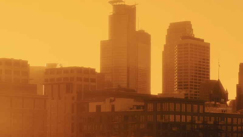 Hazy orange skies reflecting Minnesota weather and environment updates during Boundary Waters wildfire alerts.