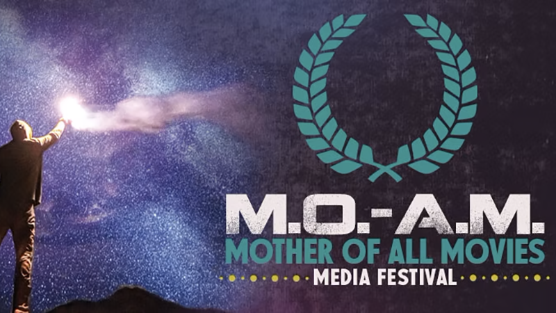 A promotional image for the M.O.-A.M. Media Festival featuring a cosmic background, a silhouetted figure holding a glowing light, and event details.