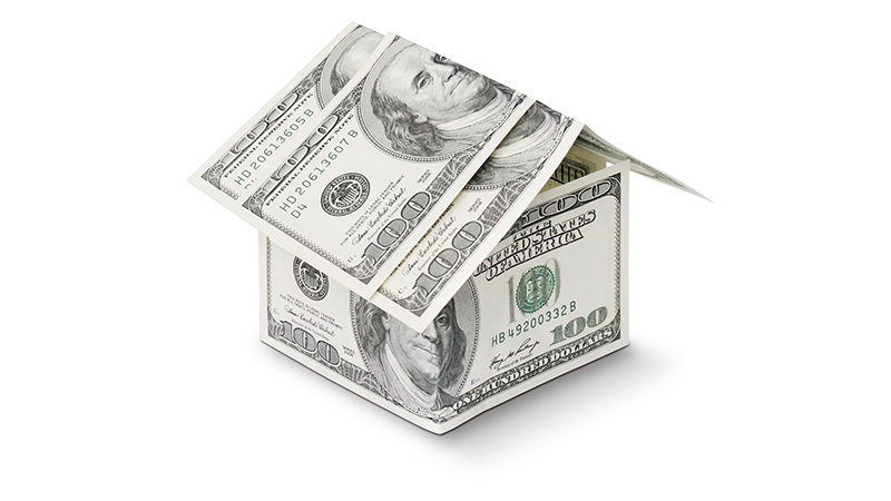 A house made of dollar bills symbolizing the cost of homeowners insurance and financial protection for your home.