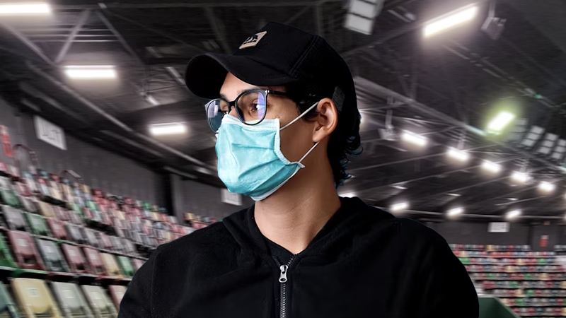A person wearing a surgical mask and glasses in a stadium setting, emphasizing health precautions during respiratory illness season.