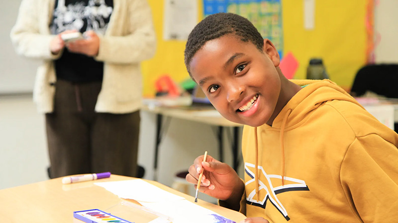 Students at the Summer Arts for Learning Academy engage in creative projects combining math, literacy, and art to enhance learning and prevent summer loss.