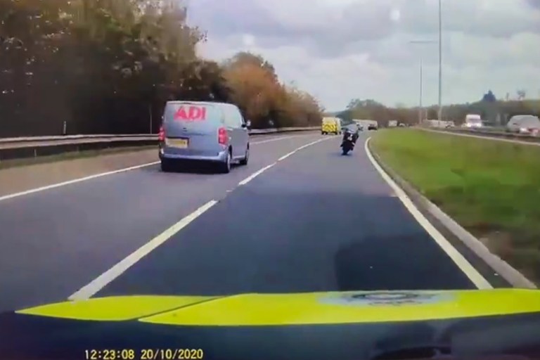 Motorcyclist Speeds Down Highway Oblivious to Police Chase