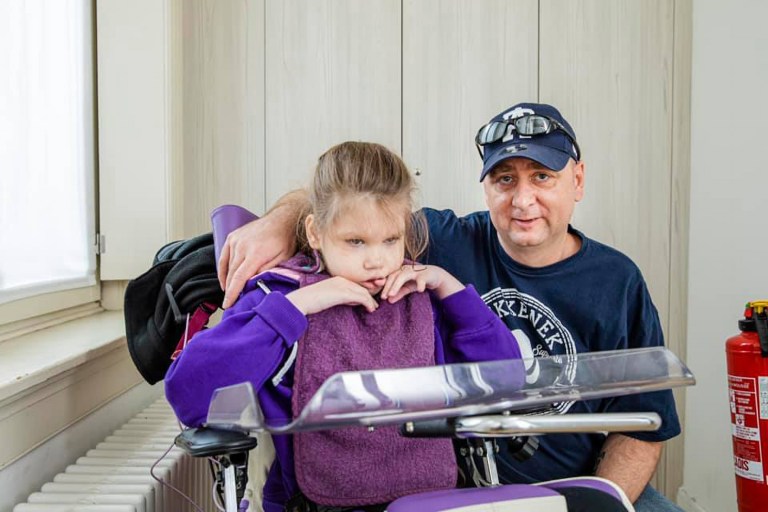 Severely disabled girl uses robot to walk