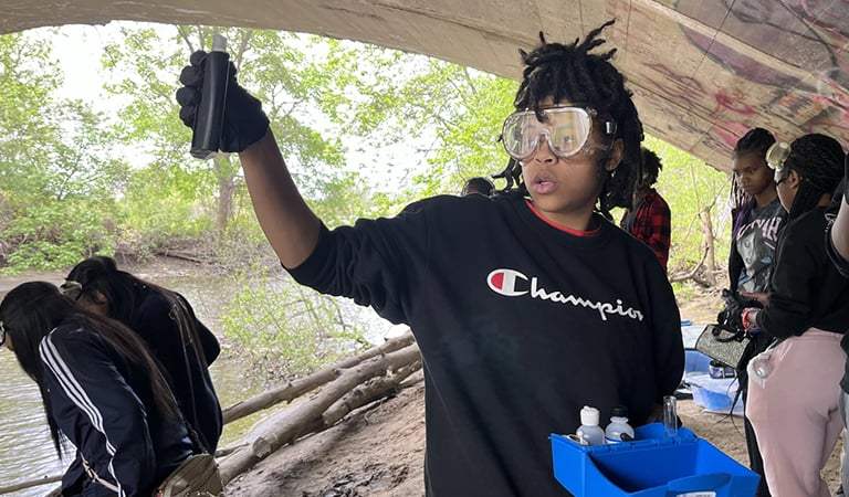 Flint students test water quality in the Flint River