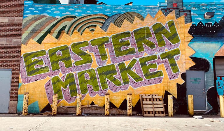 Things To Do In Detroit: Detroit’s Eastern Market has been transformed into an outdoor museum with colorful murals that address social issues and symbolize the city.  