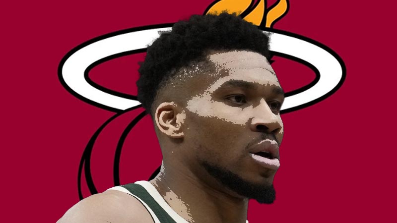 Giannis Antetokounmpo driving on the court during an NBA game.