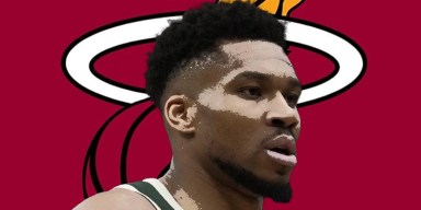 Giannis Antetokounmpo driving on the court during an NBA game.