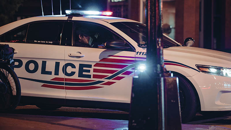 Law enforcement officers coordinating during the Detroit public safety crackdown.