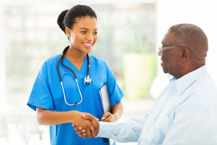 female doctor shaking patients hand