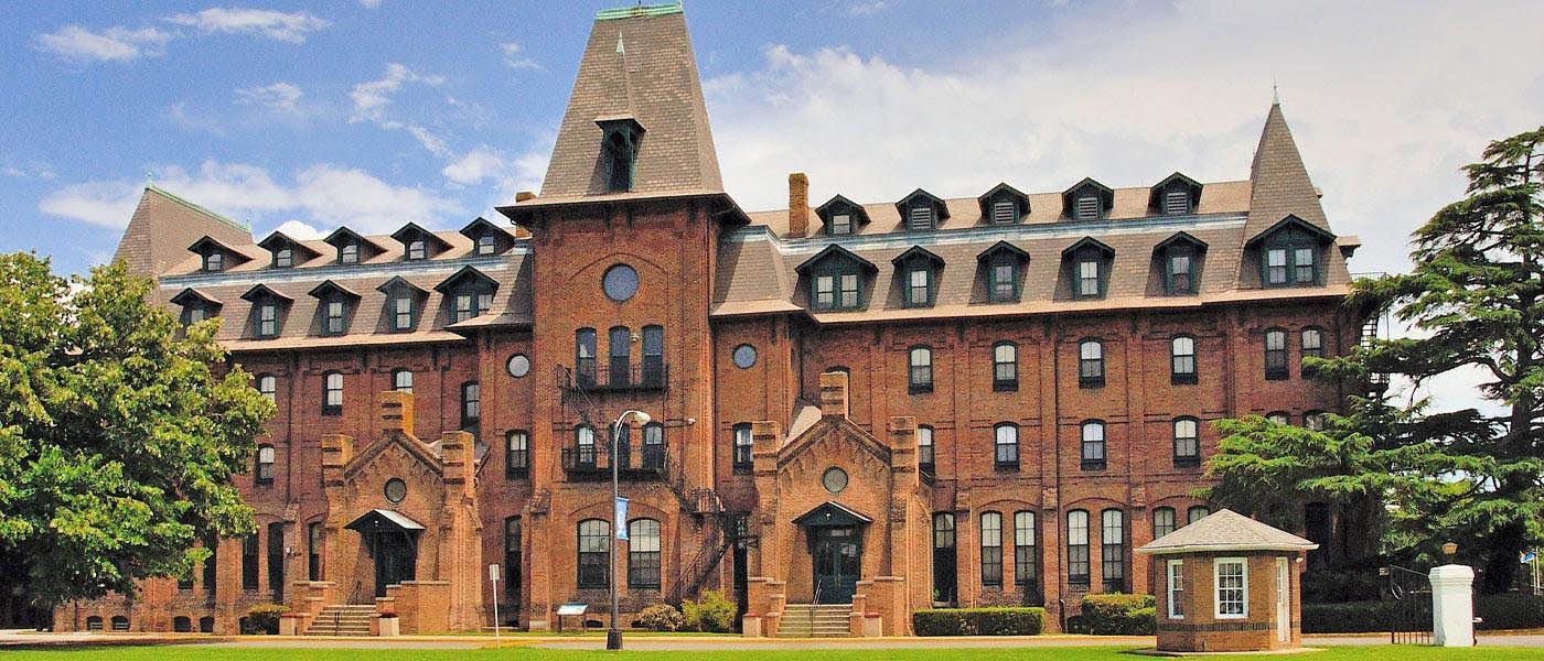 View of the Hampton University campus showing historical architecture and tree-lined grounds.