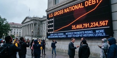 Digital display showing the surging U.S. gross national debt trajectory reaching the 40 trillion debt record milestone outside the Treasury Department building.