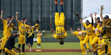 Savannah Bananas player performing trick plays on the field for things to do in Detroit at Comerica Park.