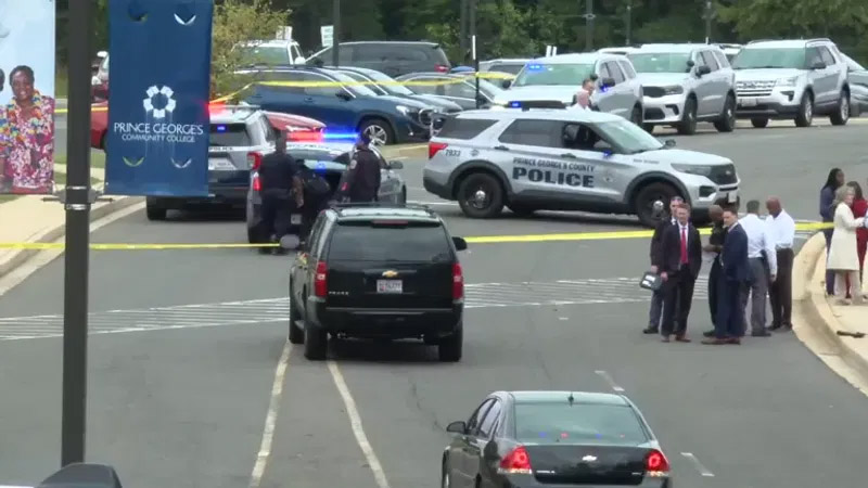 Emergency law enforcement vehicles securing college campus perimeters following a security alert.