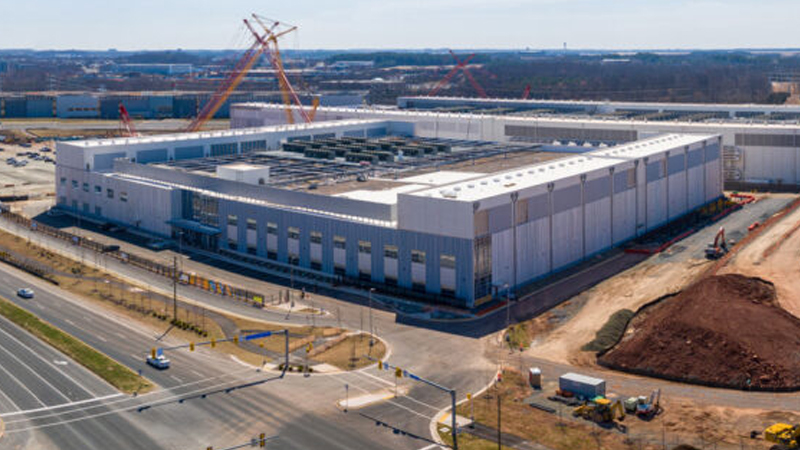Large commercial data center building with cooling infrastructure in Loudoun County Virginia.