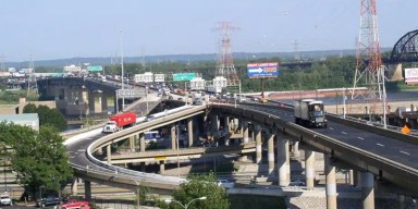 Metro East transit and police investigations showing highway work zone warning signs on an interstate approach.