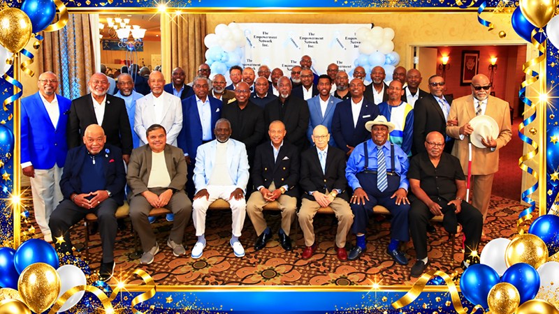Prostate cancer survivors and supporters smiling together at The Empowerment Network annual celebration in St. Louis