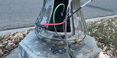 Minnesota political battles over municipal infrastructure seen through dark St. Paul streetlights stripped of copper wire: