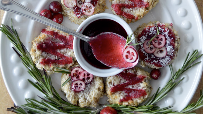 Rustic spread of warm comfort finger foods and party appetizers served on a wooden board.