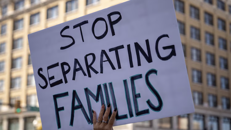 DMV public safety news protest sign reading Stop Separating Families during an immigration rally