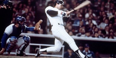 Reggie Jackson celebrating in a classic New York Yankees uniform